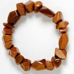 Pulsera de Aventurina Dorada de 19 piezas irregulares de aprox 10 mm. a 15 mm.
Engarzada en goma