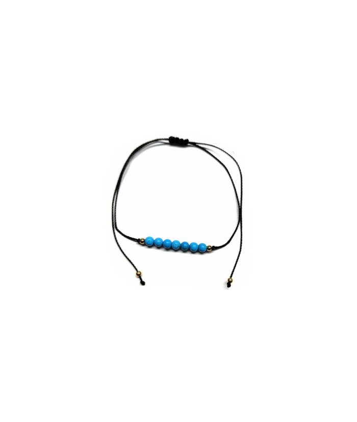 Pulsera de bolas de Turquenita de 4mm en hilo negro ajustable.

Tarjeta exclusiva en 3 idiomas.
