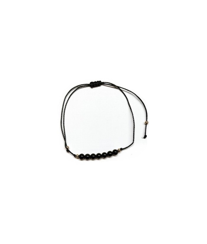 Pulsera de bolas de Onix de 4mm en hilo negro ajustable.

Tarjeta exclusiva en 3 idiomas.