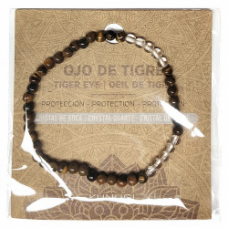 Pulsera de Ojo de Tigre y Cristal de Roca en bolas de 4mm.

En goma elástica.

Tarjeta exclusiva en 3 idiomas.