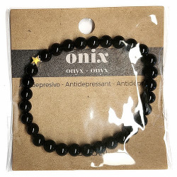 Pulsera de Ónix( bolas de 6mm) con símbolo de estrella dorada.

En goma elástica.

Tarjeta exclusiva en 3 idiomas.