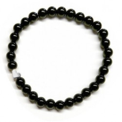 Pulsera de Ónix( bolas de 6mm) con símbolo de corazón plateado.

En goma elástica.

Tarjeta exclusiva en 3 idiomas.