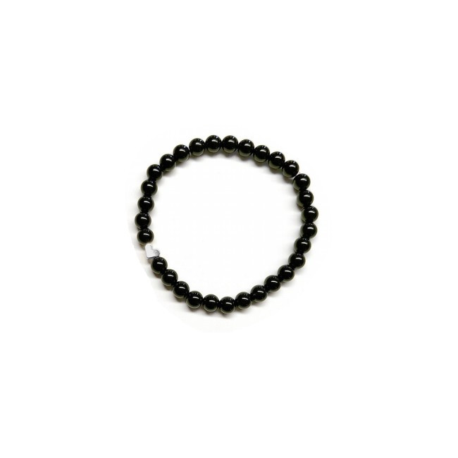 Pulsera de Ónix( bolas de 6mm) con símbolo de corazón plateado.

En goma elástica.

Tarjeta exclusiva en 3 idiomas.