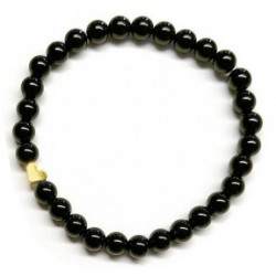 Pulsera de Ónix( bolas de 6mm) con símbolo de corazón dorado.

En goma elástica.

Tarjeta exclusiva en 3 idiomas.