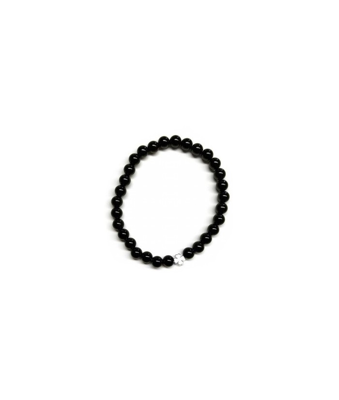 Pulsera de Ónix( bolas de 6mm) con símbolo de trébol plateado.

En goma elástica.

Tarjeta exclusiva en 3 idiomas.