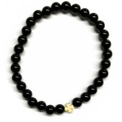 Pulsera de Ónix( bolas de 6mm) con símbolo de trébol dorado.

En goma elástica.

Tarjeta exclusiva en 3 idiomas.