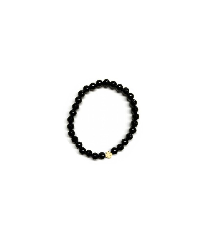 Pulsera de Ónix( bolas de 6mm) con símbolo de trébol dorado.

En goma elástica.

Tarjeta exclusiva en 3 idiomas.
