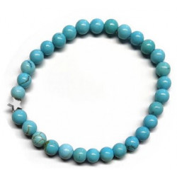 Pulsera de Turquenita (bolas de 6mm) con símbolo de estrella plateada.

En goma elástica.