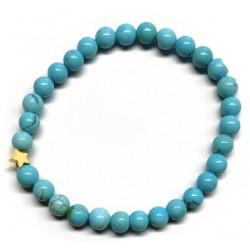 Pulsera de Turquenita (bolas de 6mm) con símbolo de estrella dorada.

En goma elástica.

Tarjeta exclusiva en 3 idiomas