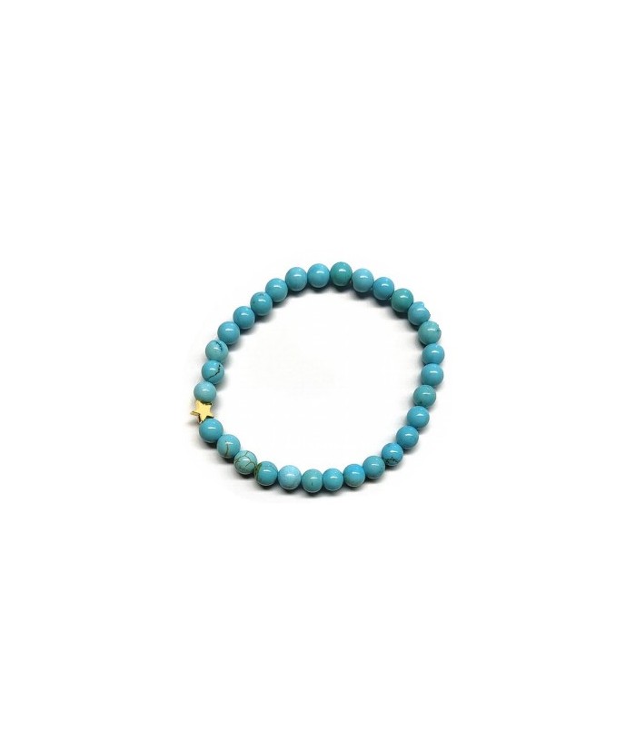 Pulsera de Turquenita (bolas de 6mm) con símbolo de estrella dorada.

En goma elástica.

Tarjeta exclusiva en 3 idiomas