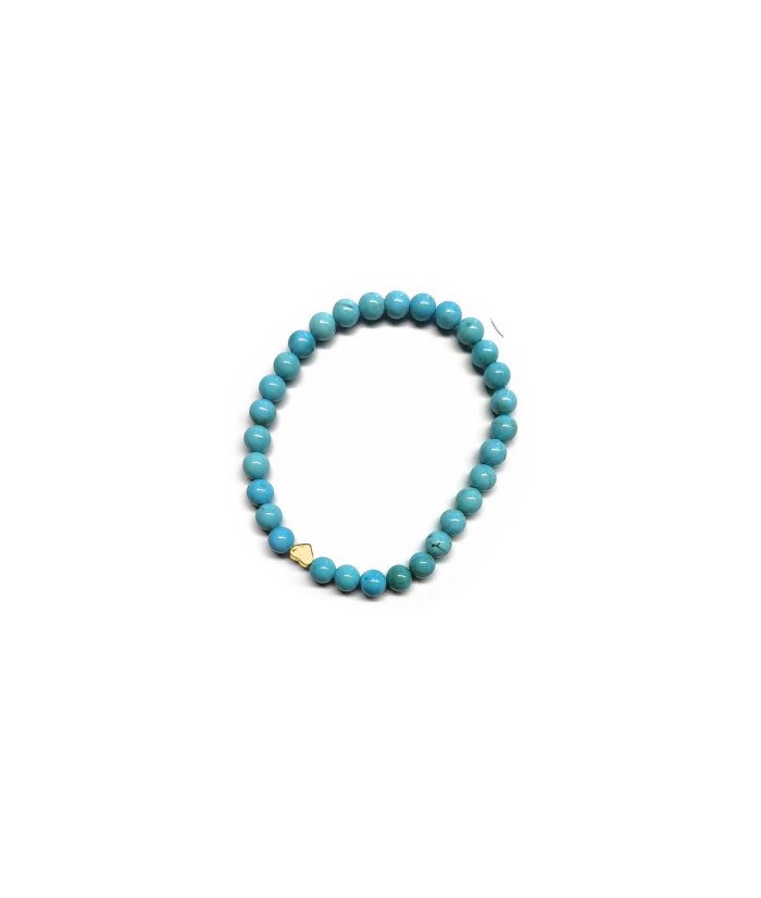 Pulsera de Turquenita (bolas de 6mm) con símbolo de corazón dorado.

En goma elástica.

Tarjeta exclusiva en 3 idiomas.