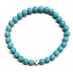 Pulsera de Turquenita (bolas de 6mm) con símbolo de trébol plateado.

En goma elástica.

Tarjeta exclusiva en 3 idiomas