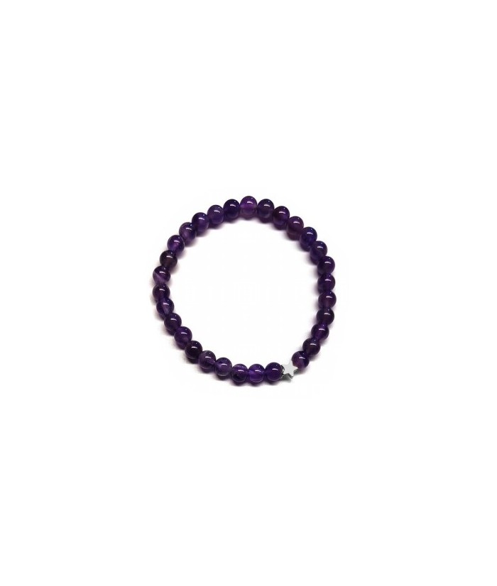 Pulsera de Amatista (bolas de 6mm) con símbolo de estrella plateada.

En goma elástica.

Tarjeta exclusiva en 3 idiomas.
