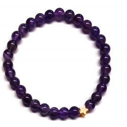 Pulsera de Amatista (bolas de 6mm) con símbolo de estrella dorada.

En goma elástica.

Tarjeta exclusiva en 3 idiomas.