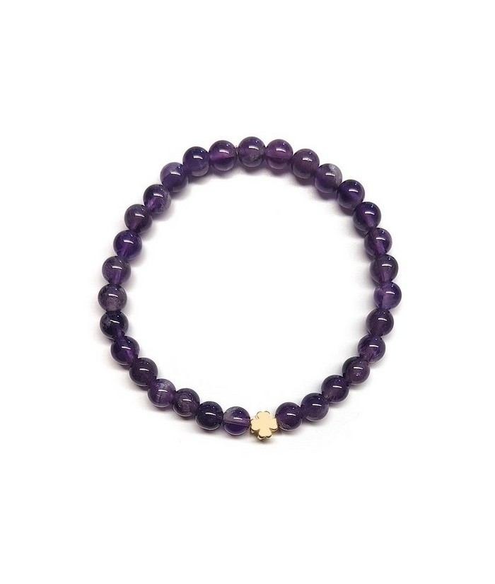Pulsera de Amatista (bolas de 6mm) con símbolo de trébol dorado.

En goma elástica.

Tarjeta exclusiva en 3 idiomas.