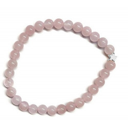 Pulsera de Cuarzo Rosa (bolas de 6mm) con símbolo de estrella plateada.

En goma elástica.

Tarjeta exclusiva en 3 idiomas.