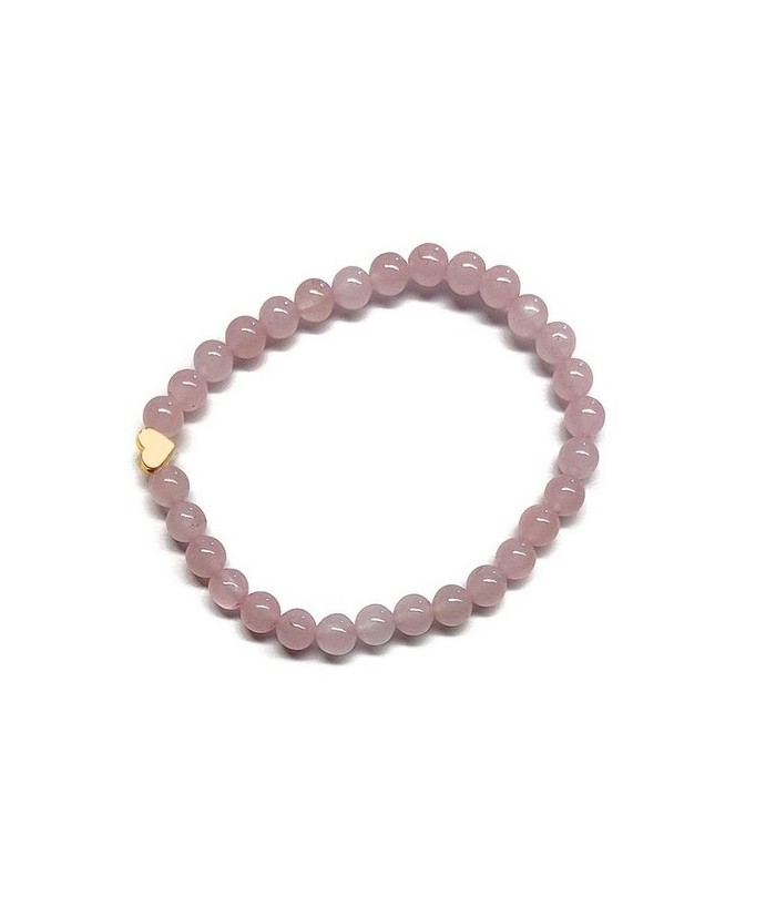 Pulsera de Cuarzo Rosa (bolas de 6mm) con símbolo de corazón dorado.

En goma elástica.

Tarjeta exclusiva en 3 idiomas.