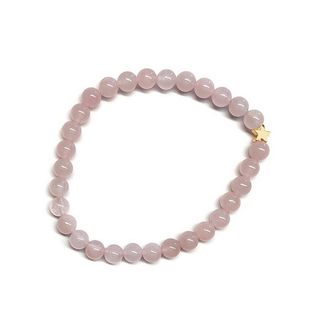Pulsera de Cuarzo Rosa (bolas de 6mm) con símbolo de estrella dorada.

En goma elástica.

Tarjeta exclusiva en 3 idiomas.