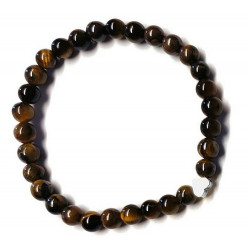 Pulsera de Ojo de Tigre (bolas de 6mm) con símbolo de corazón plateado.

En goma elástica.

Tarjeta exclusiva en 3 idiomas.