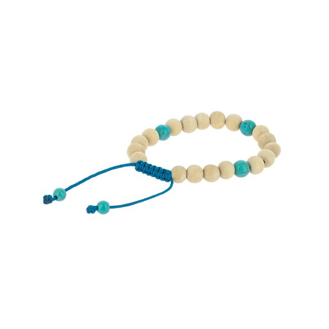Las pulseras malas de madera, como esta en tonos claros, son accesorios llenos de significado que pueden acompañarte en la medi