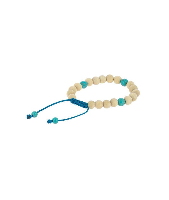 Las pulseras malas de madera, como esta en tonos claros, son accesorios llenos de significado que pueden acompañarte en la medi